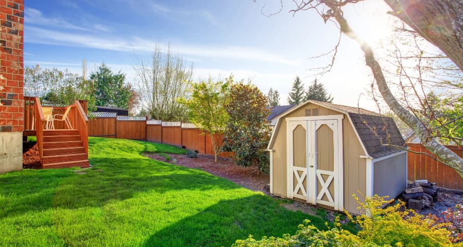 Fenced backyard with storage shed in West Bloomfield